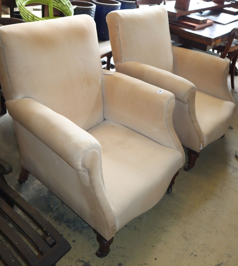 A pair of late Victorian upholstered armchairs